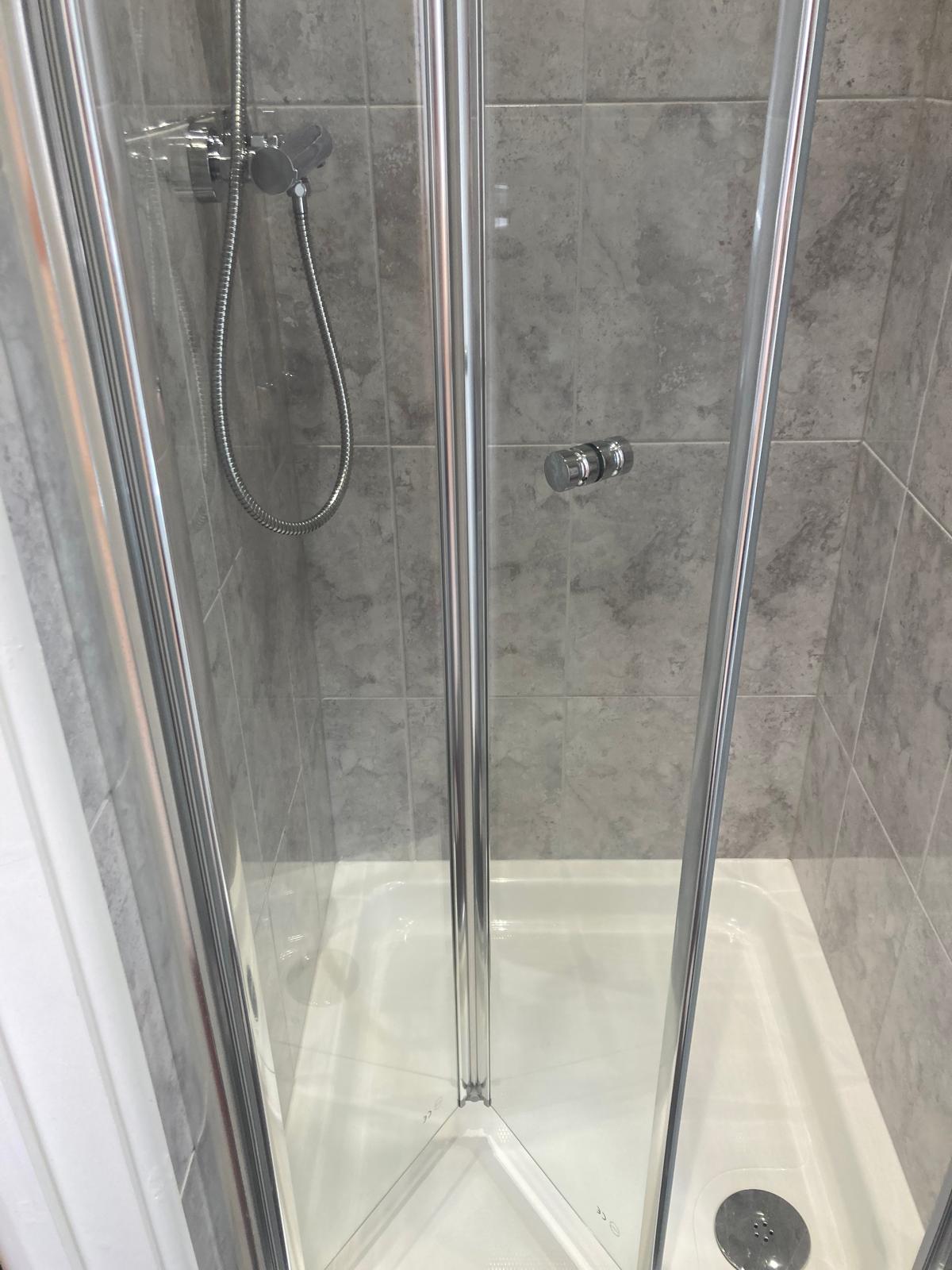 Deep cleaned shower and glass screen free of limescale