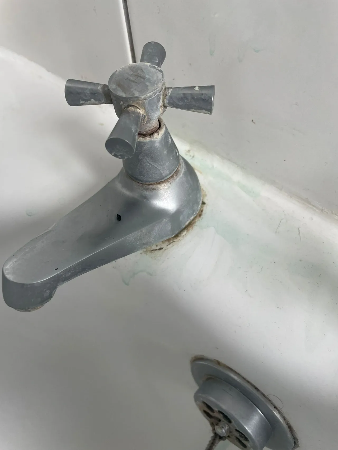Cleaner sanitising bathroom tiles and taps